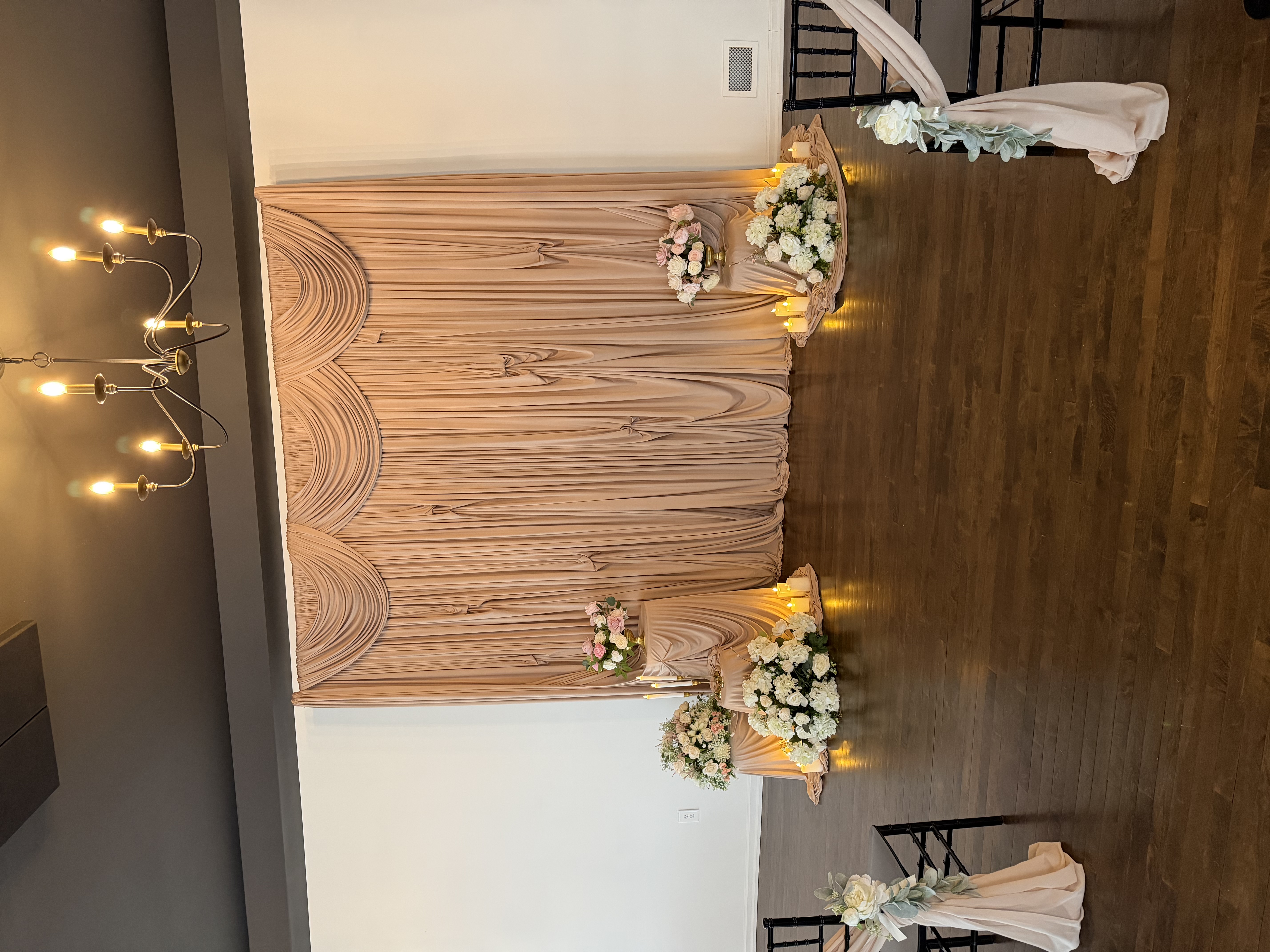 Blush ceremony draping backdrop and altar at Haley Station wedding venue, Escanaba Michigan