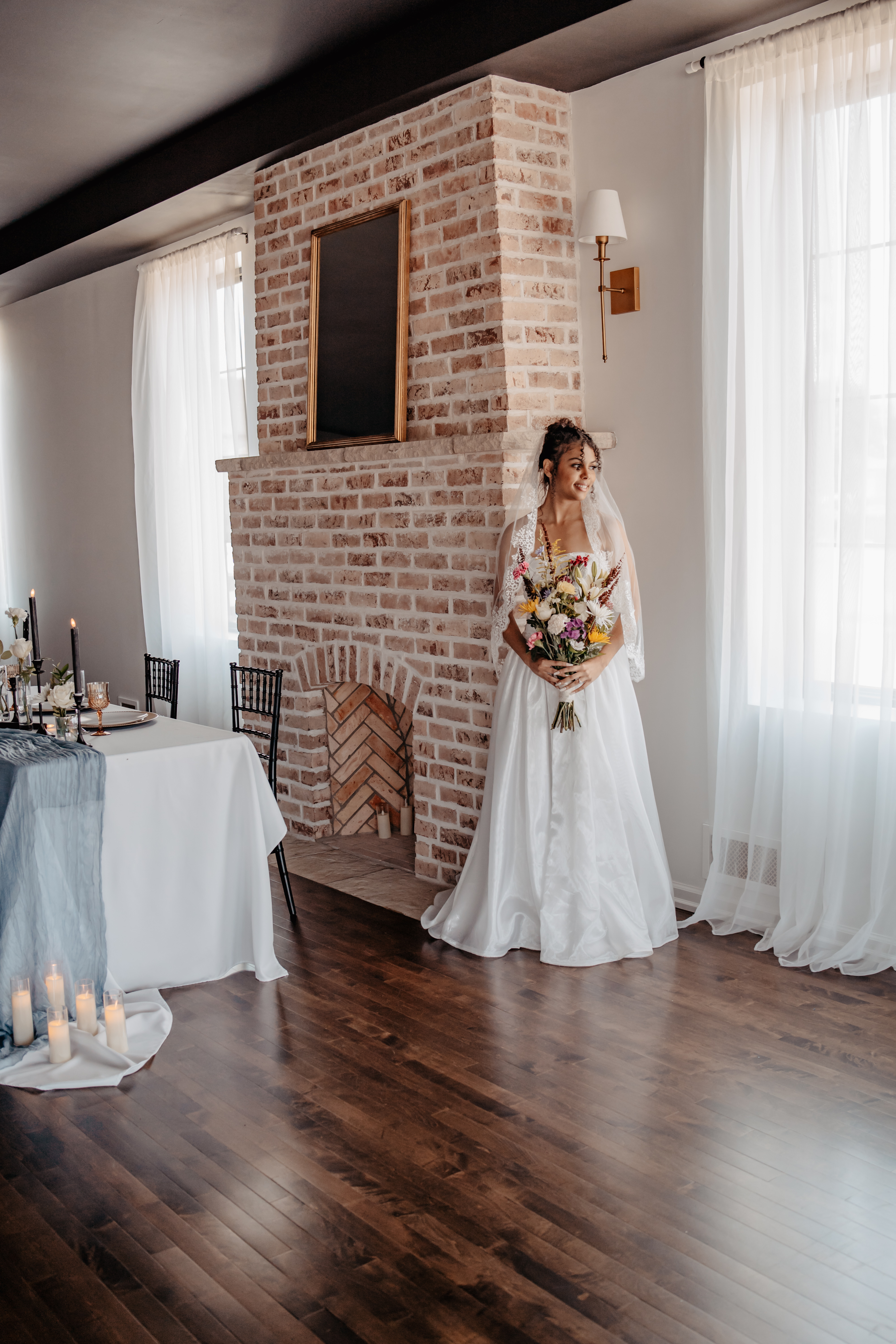 Bride near fireplace at Haley Station wedding venue, Escanaba Michigan