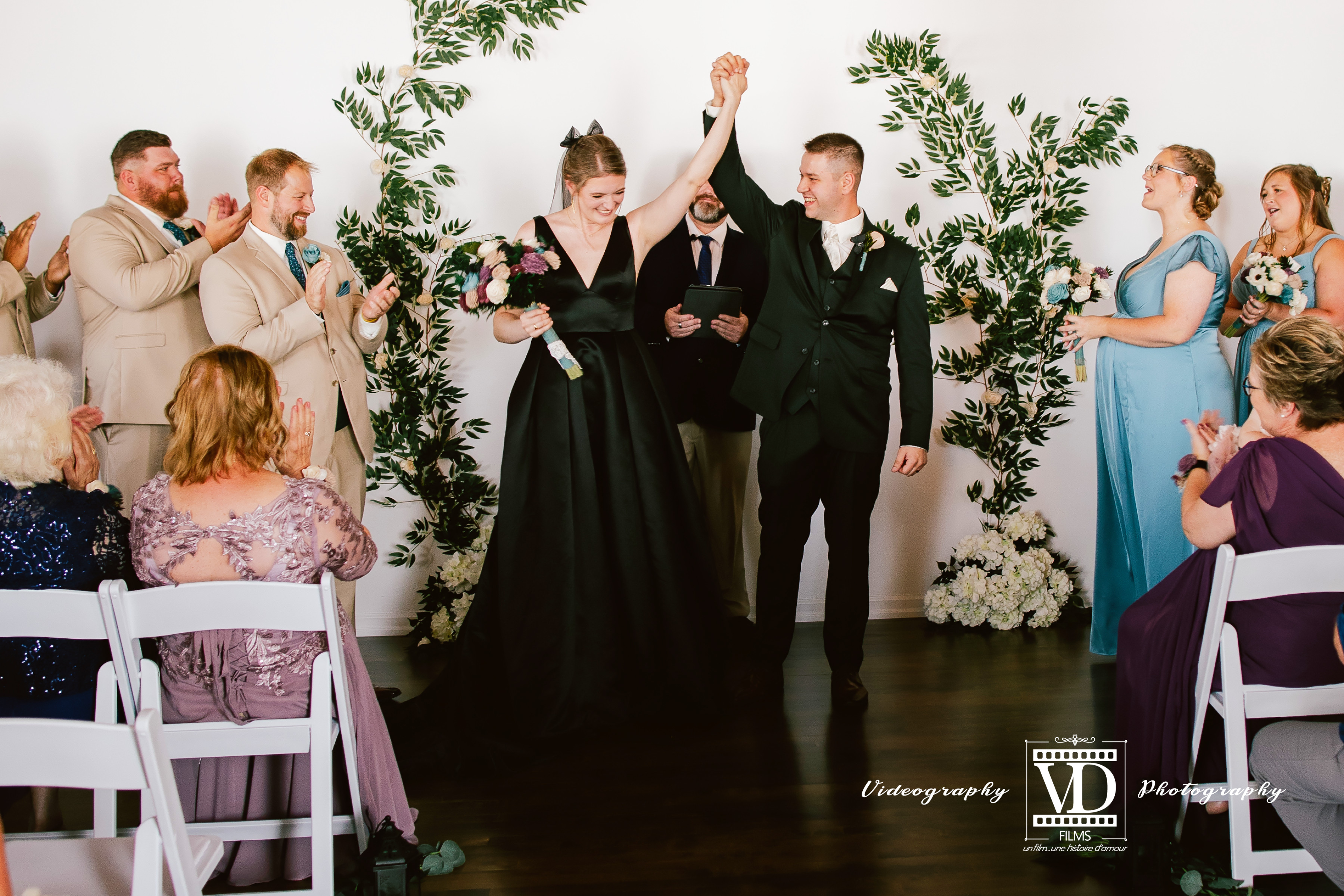 Couple celebrating recessional at Haley Station wedding venue, Escanaba Michigan
