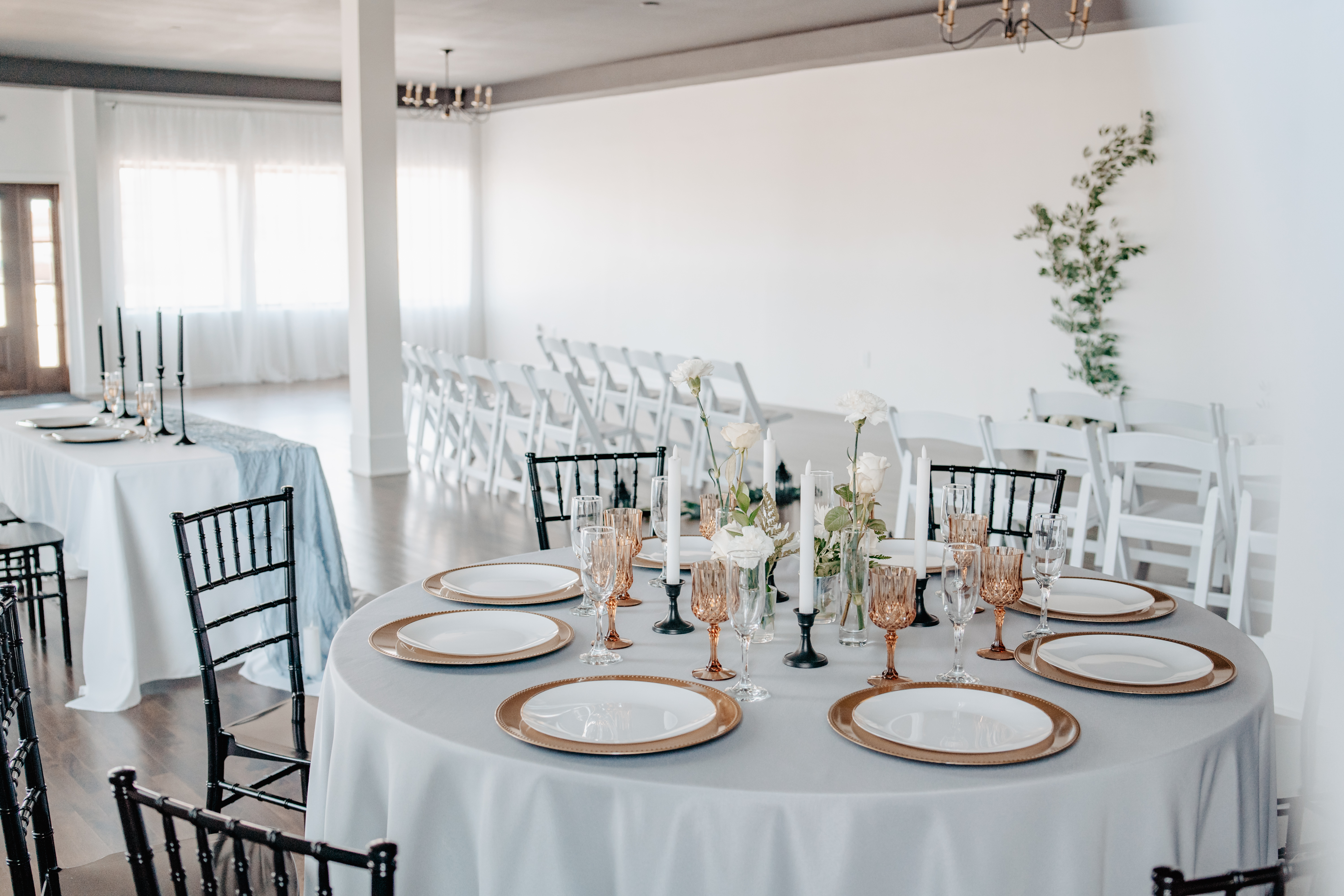 Full wedding reception room with gold chargers at Haley Station, Escanaba Michigan