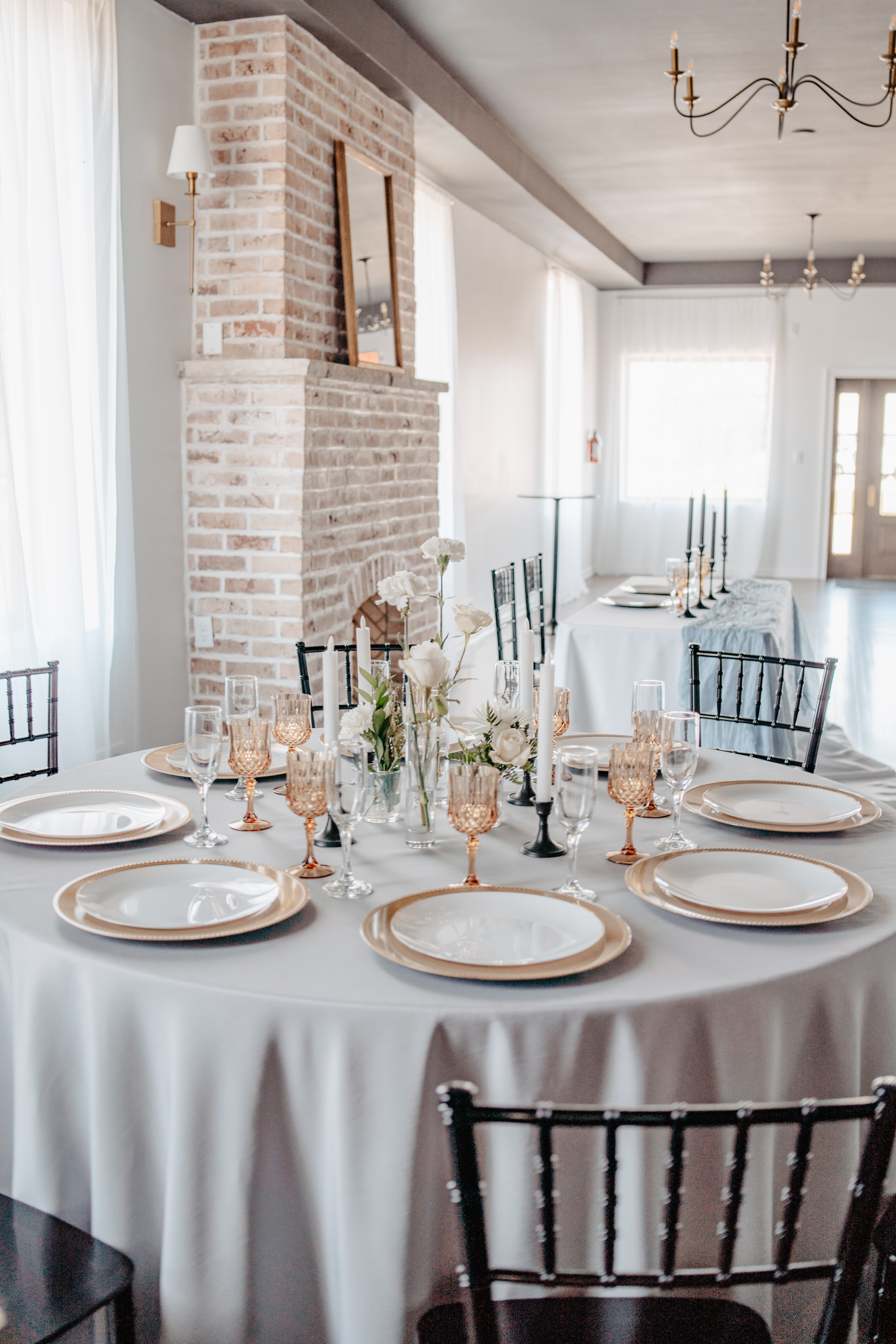Wedding table setting near fireplace at Haley Station, Escanaba Michigan